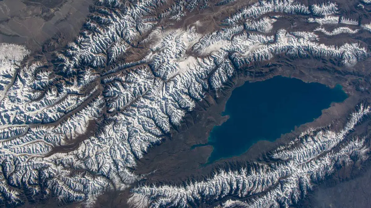 You can experience stunning, live HD views of Earth as seen from the International Space Station (ISS), streamed directly from NASA's external cameras. Photo: Issyk-Kul Lake in the central Asian nation of Kyrgyzstan is surrounded by the snow-capped Tian Shen mountains.