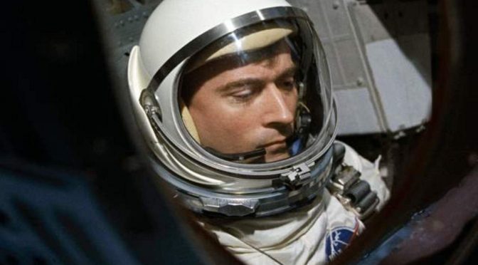 John W. Young is seen through the spacecraft window prior to launch of Gemini-Titan 3 mission