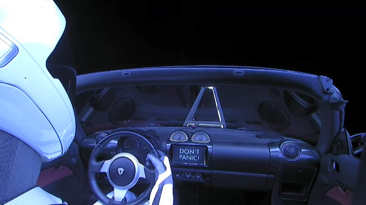 Falcon Heavy Test Flight: Tesla in space. Don't Panic!