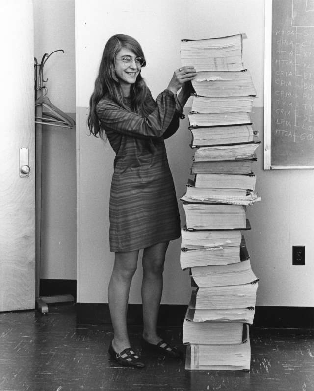Margaret Hamilton standing next to Apollo 11 Code