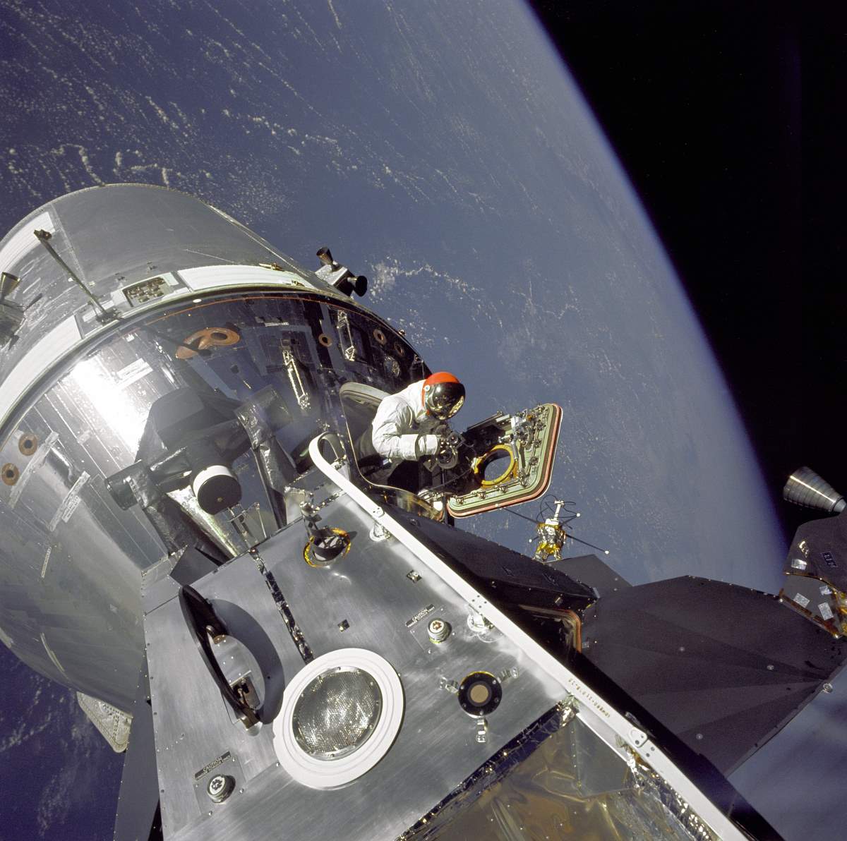 Astronaut Dave Scott emerges from the Apollo 9 Command Module "Gumdrop"