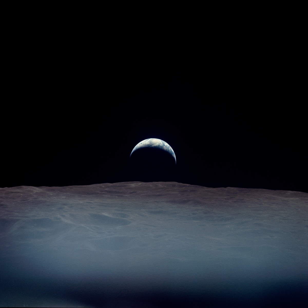Earth rises just west of Crater Pasteur - Apollo 12 image