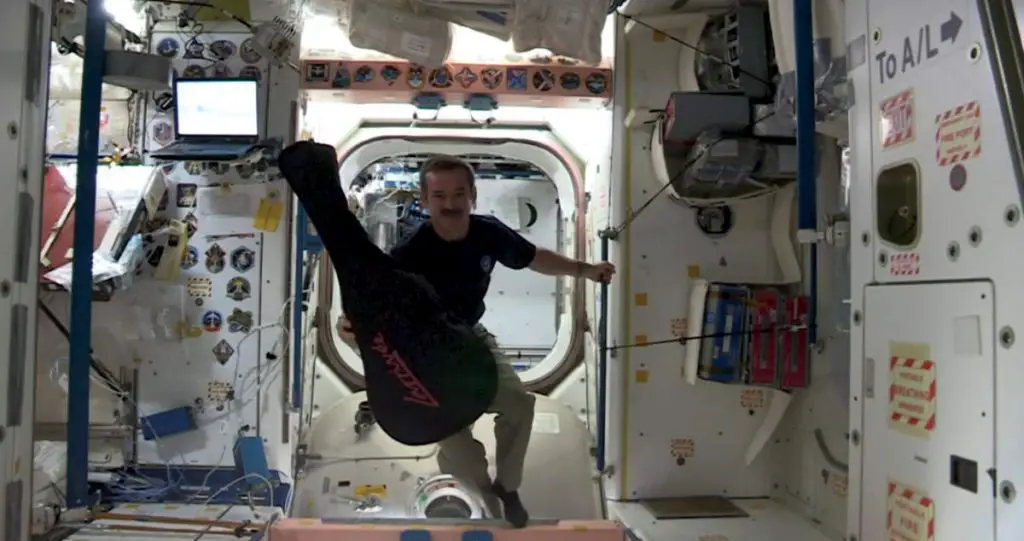 An Astronaut's Christmas Carol - Jewel in the Night. Chris Hadfield with his guitar in the ISS