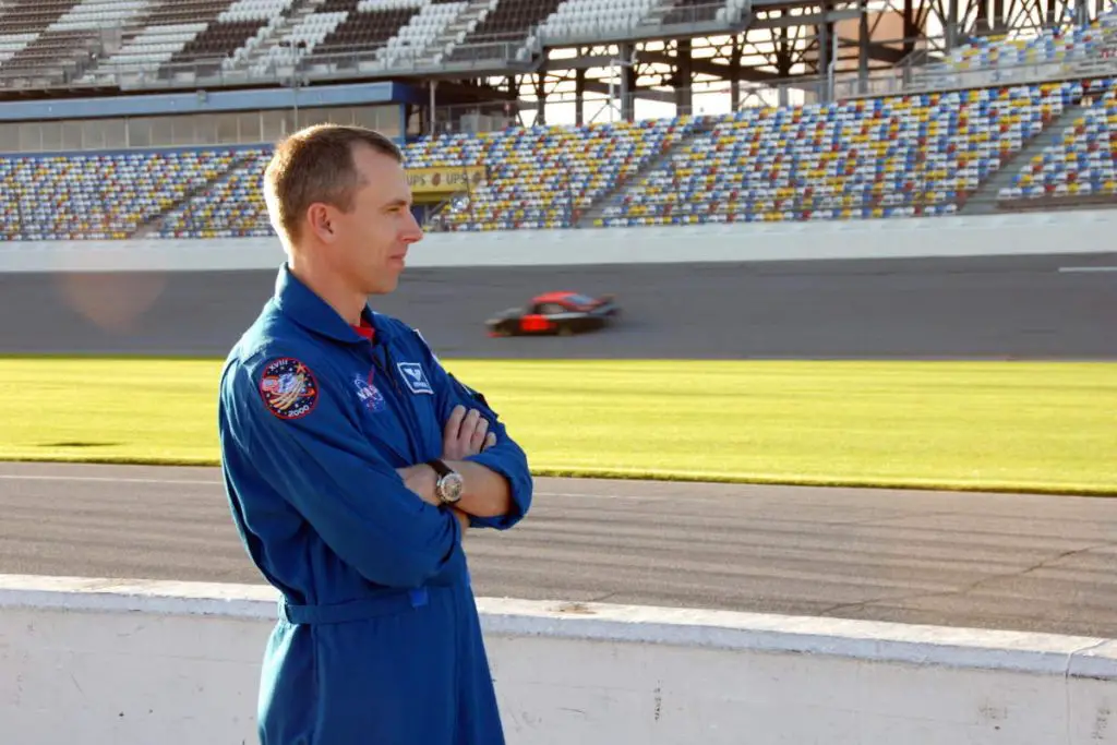 Auto innovations driven by NASA research: Astronaut Andrew Feustel watched cars on the Daytona International Speedway in 2008