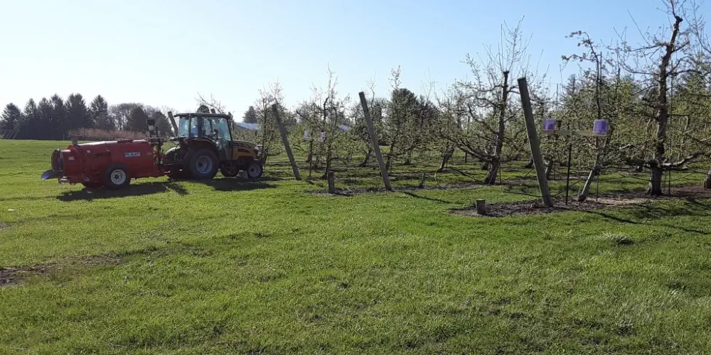 Tractor pulls a sprayer