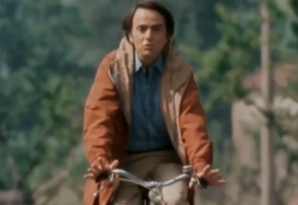 Carl Sagan rides a bike and explains why the speed of light is a universal constant