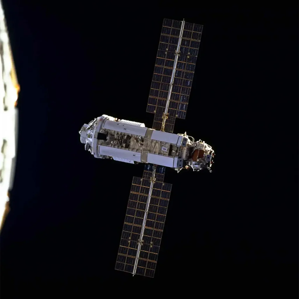 The first International Space Station module Zarya orbits Earth